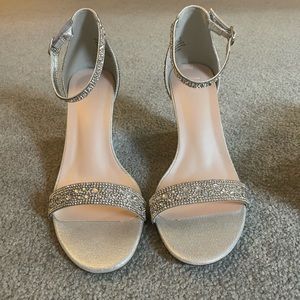 NEVER WORN!!! Beautiful silver wedge heels great for formal events!!